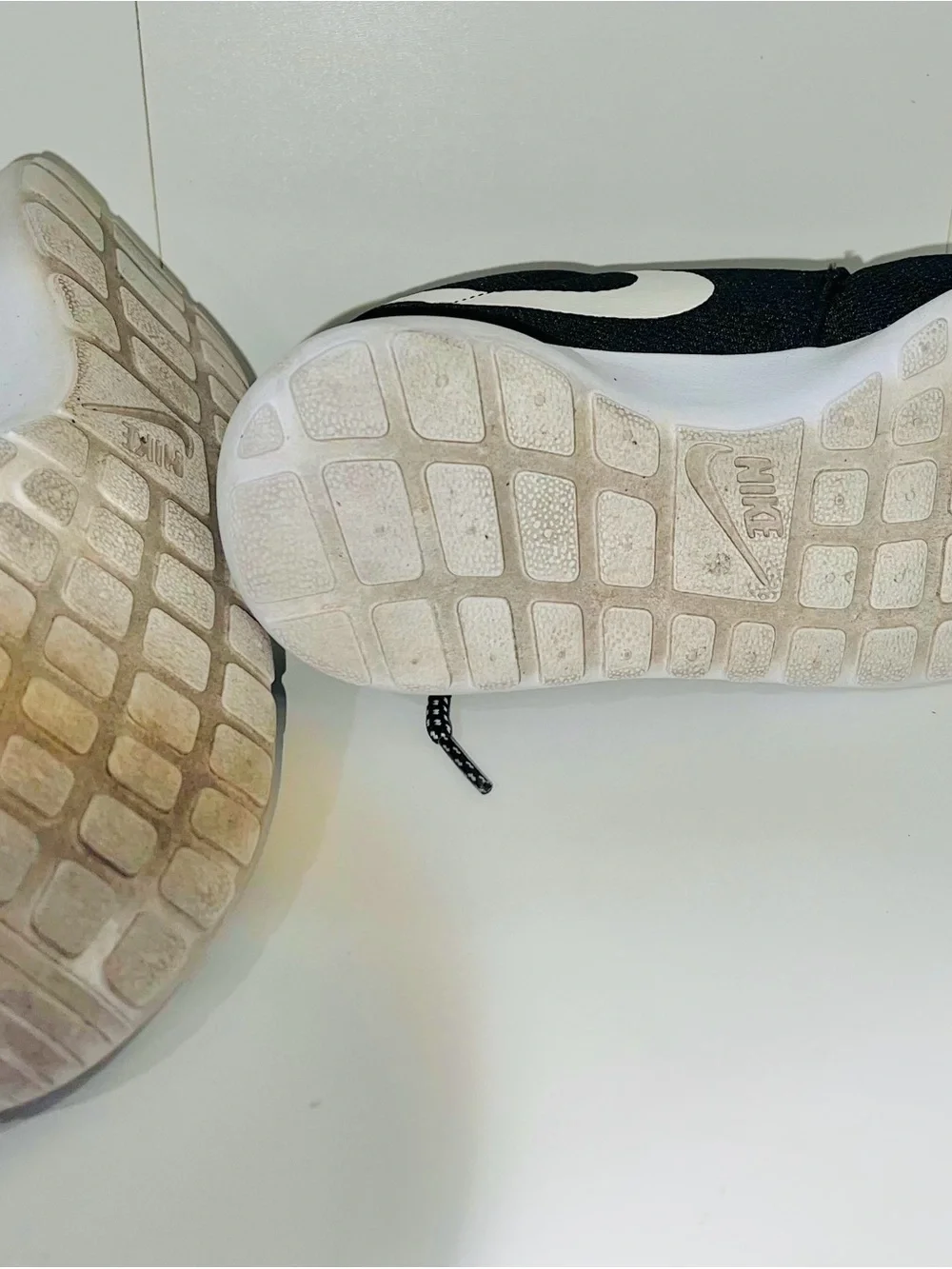 Nike Men’s Black Sneakers with White Swoosh and White Sole